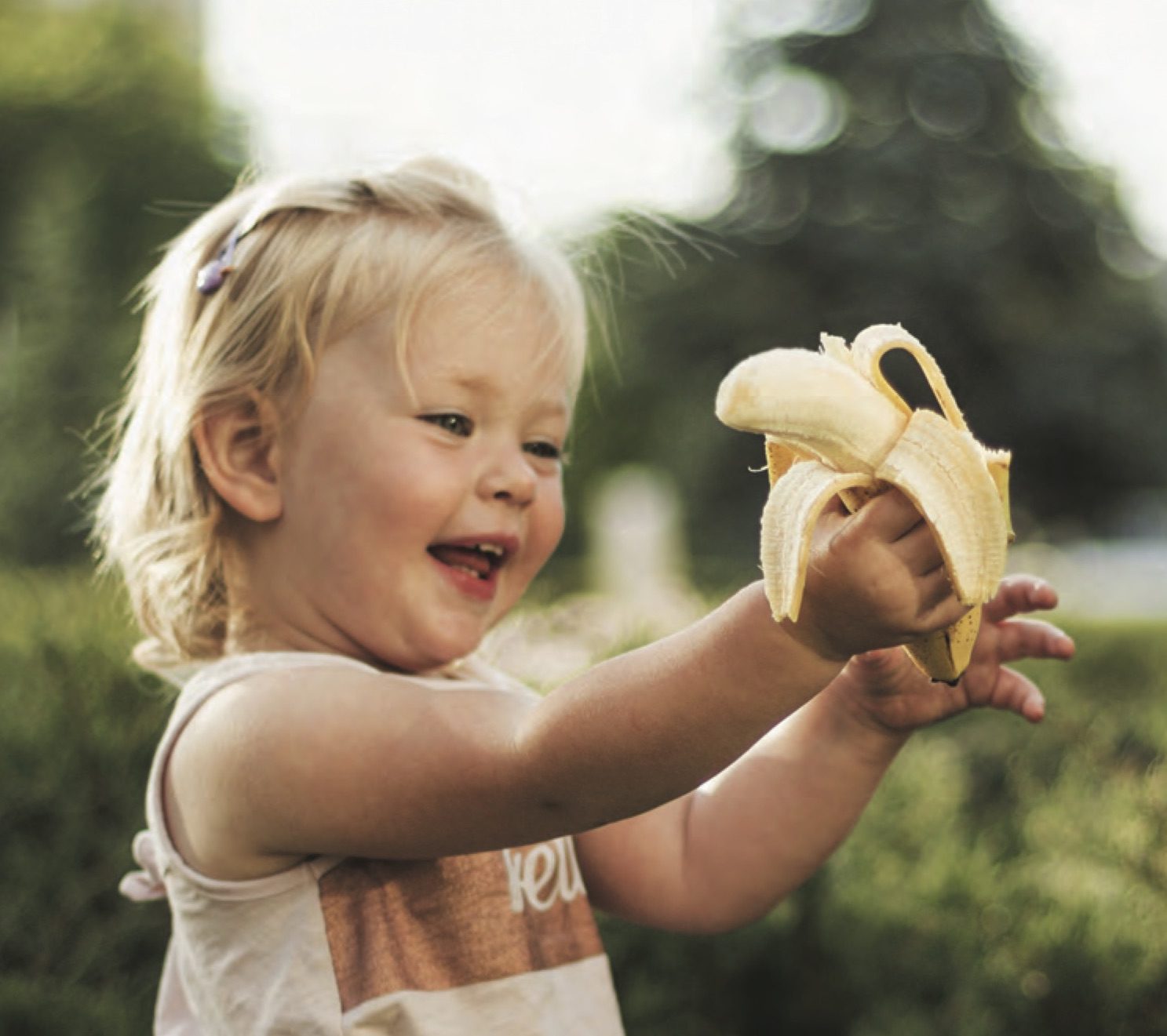 Little girl with banana