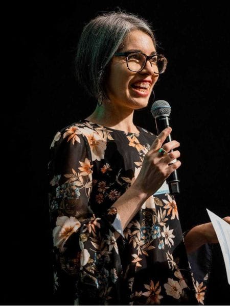 Rebecca Stonor speaking on stage at NIHC23